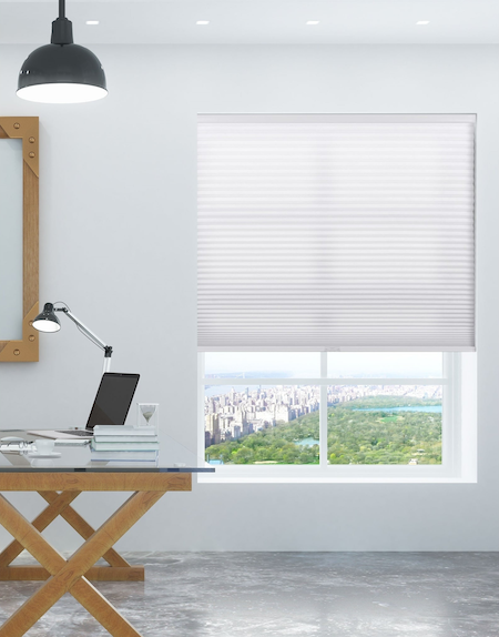 honeycomb blind in an apartment office area with a view